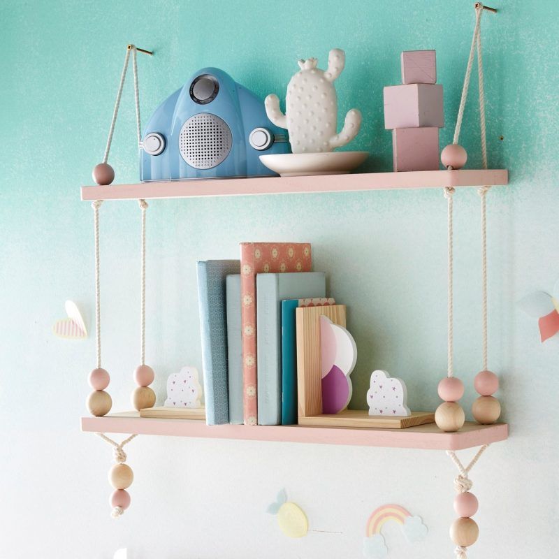 Pair of pink, rope suspended wall shelves