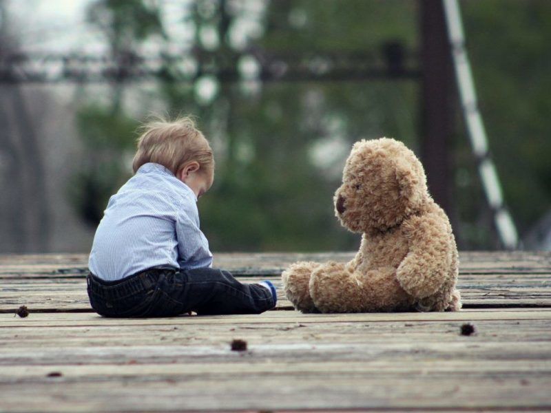 Young boy and teddy bear