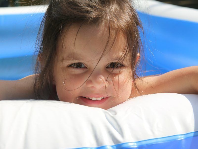 Child in paddling pool