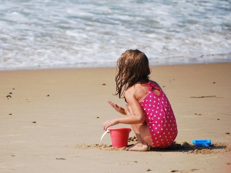 Girl playing on the beach