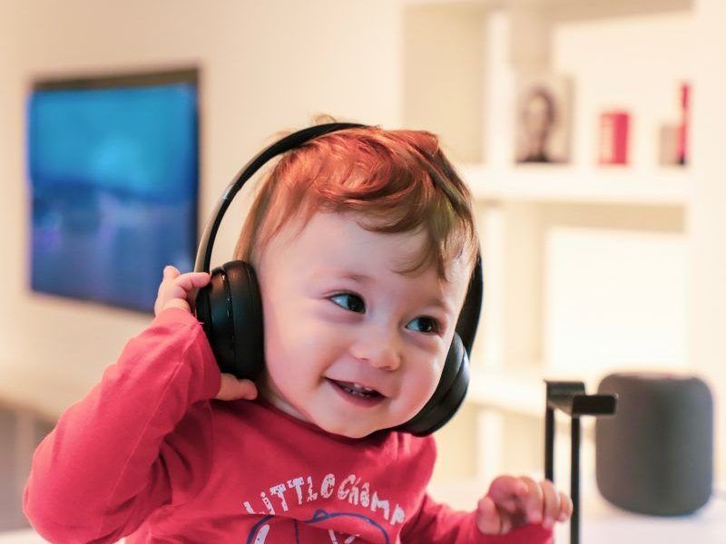 Child listening through headphones