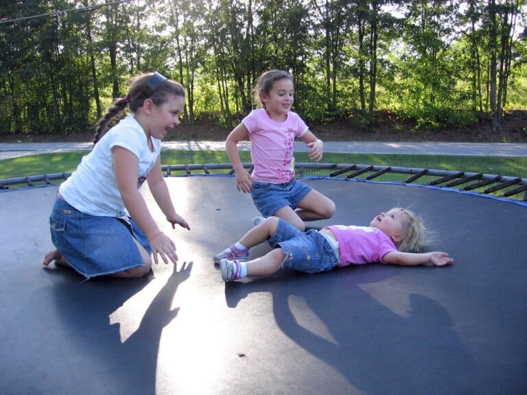 children playing on a trampoline