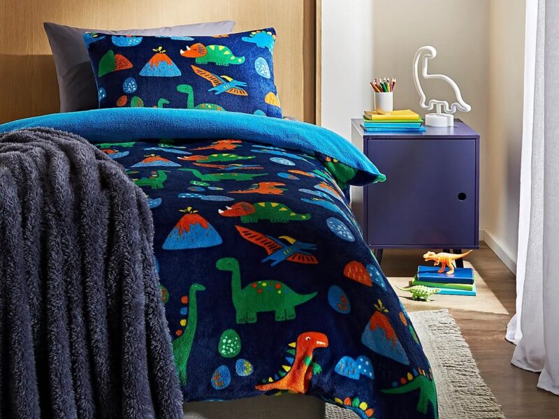 Dark blue fleece fabric bedding with dinosaur figures