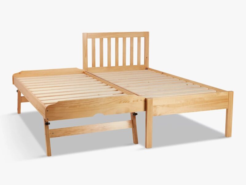 Wooden bed frame with raiseable guest bed