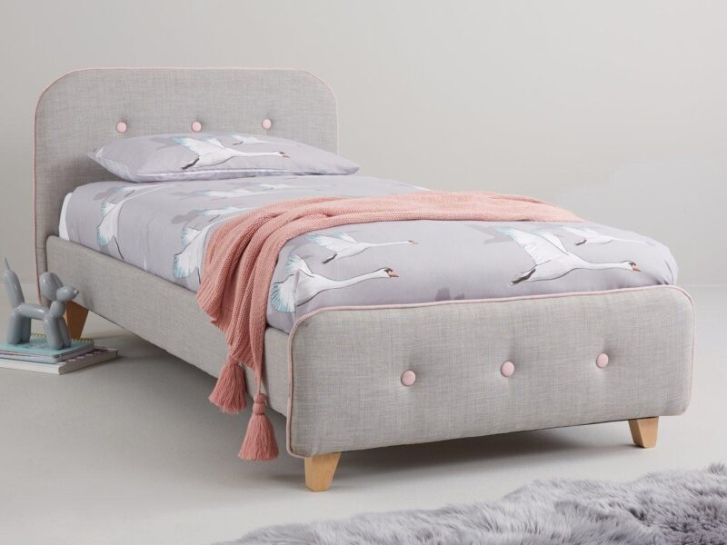 Grey fabric upholstered bed with pink detailing