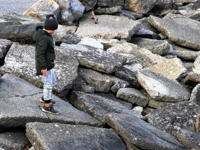 Child walking on rocks