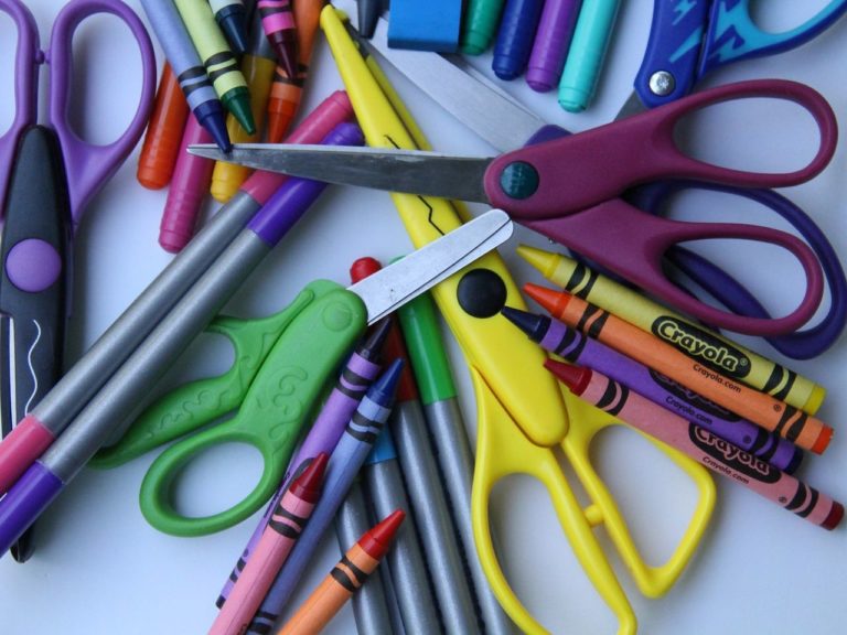 Assorted crayons, pencils, scissors, etc