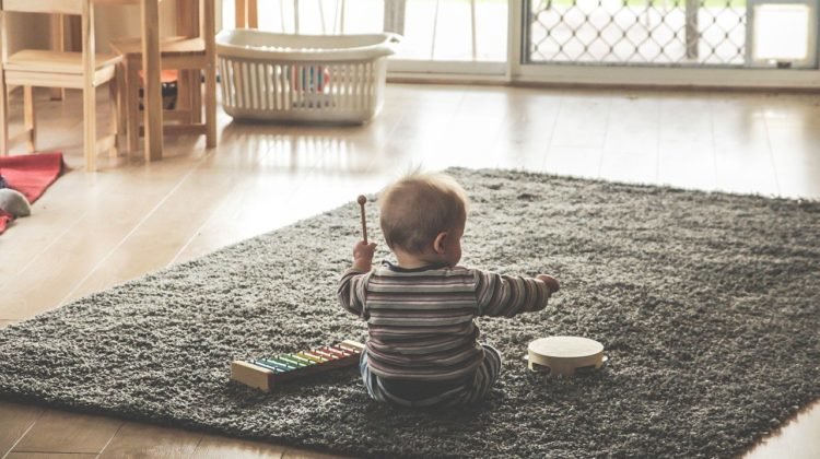 Young child happily playing alone 