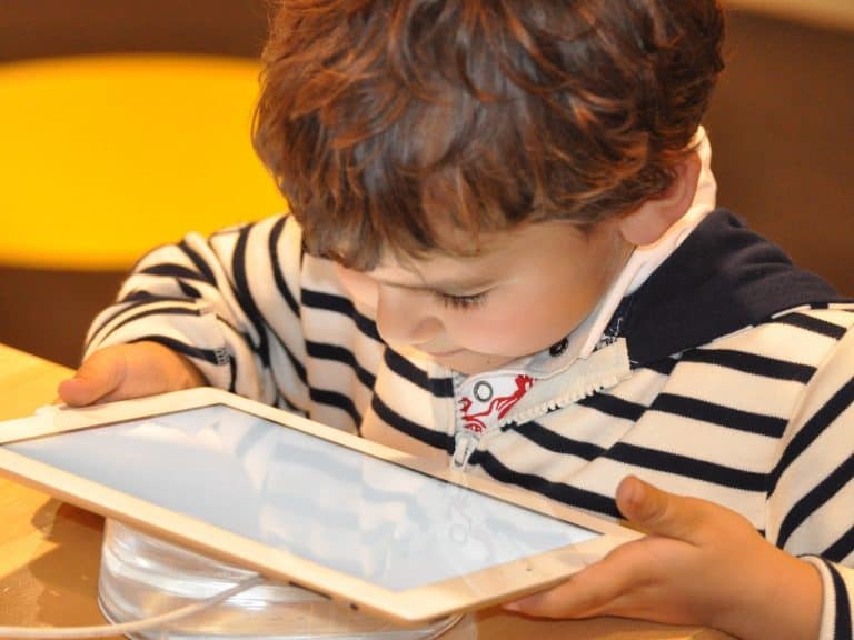 Child playing with a tablet computer