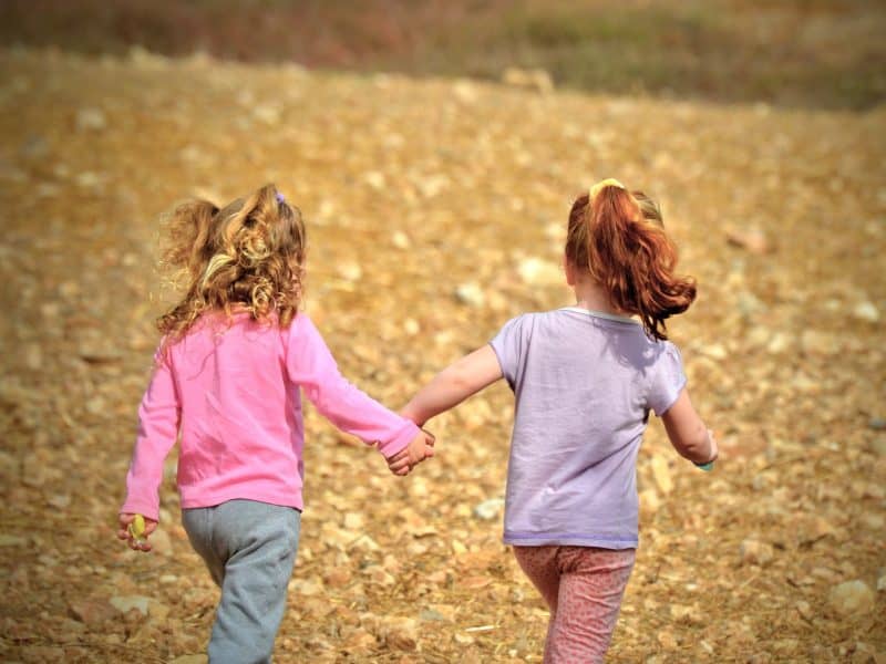 2 girls running and playing