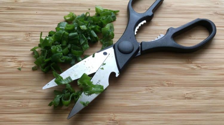 Chopping herbs with scissors