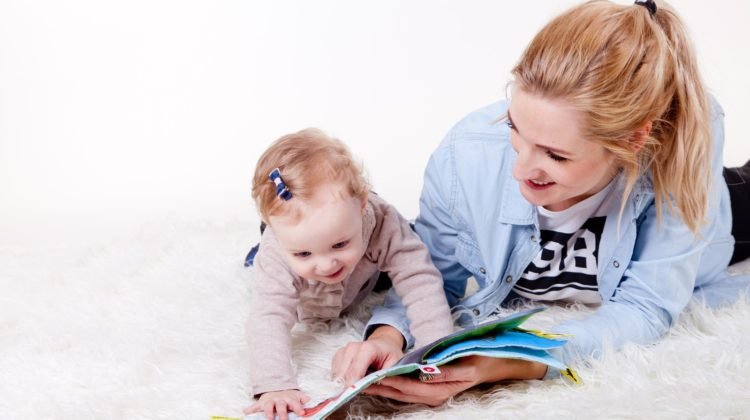 Mum reading to her child