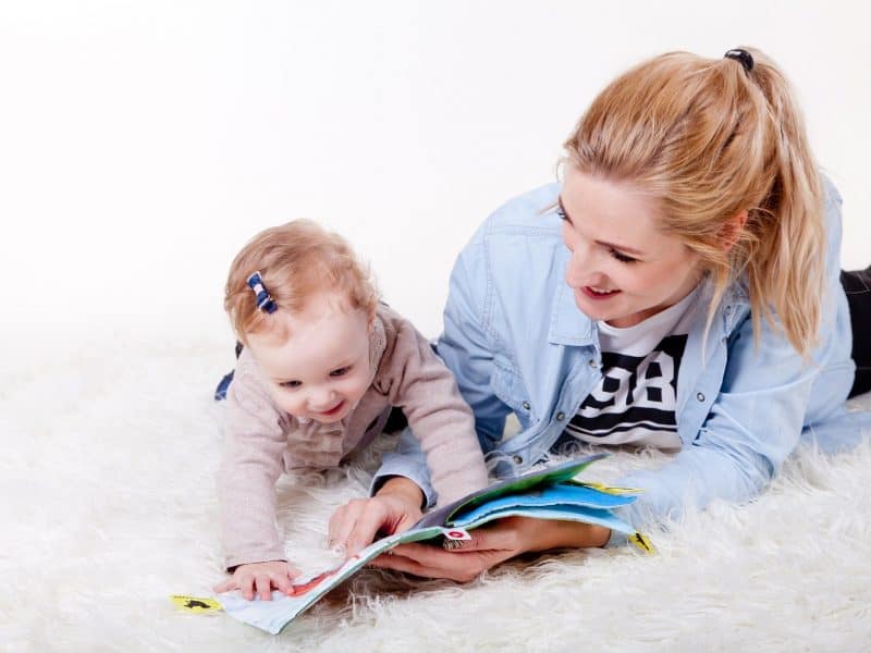 Mum reading to her child