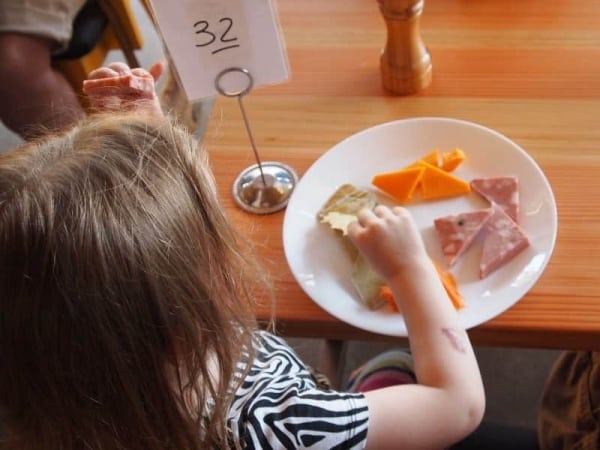 Child picking at her food