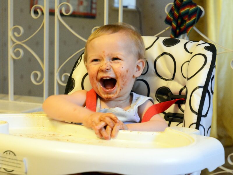 Child creating a mess whilst eating