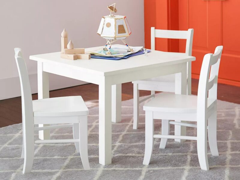 Kid's white-painted play table and set of two chairs