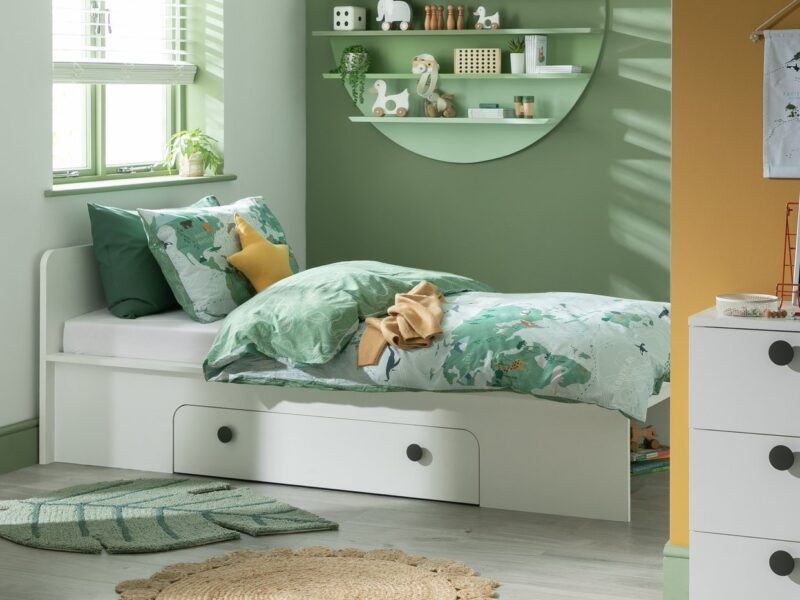 White single storage bed with round grey drawer handles