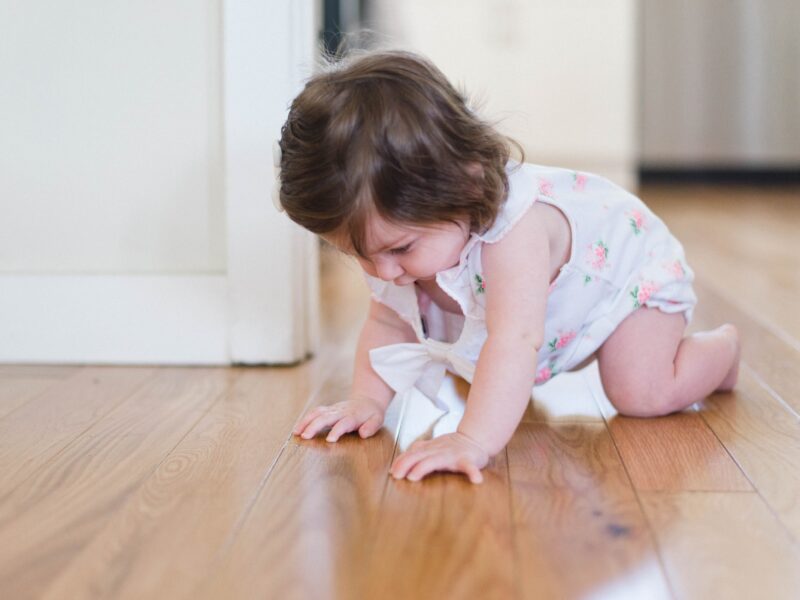 Baby crawling on a laminate floor