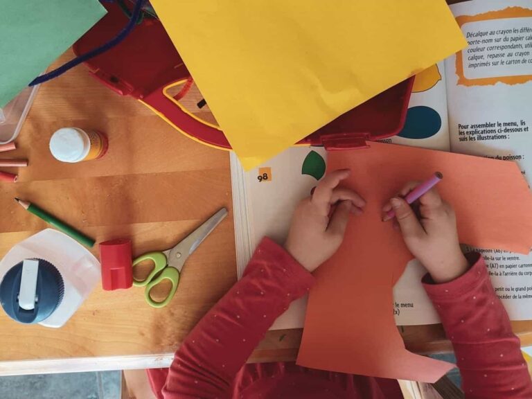 Child engaged in craft lesson