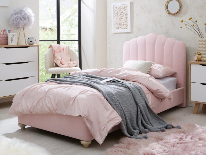 Pink fabric upholstered bed