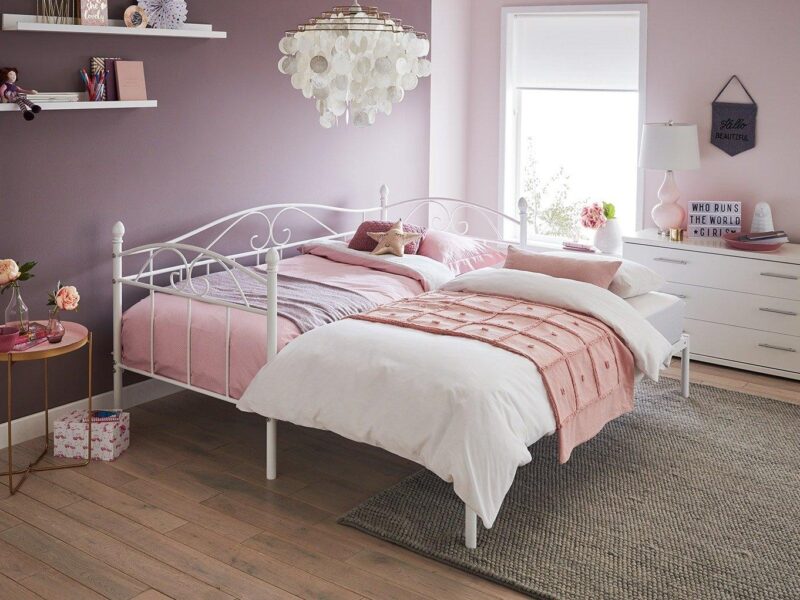 White vintage-style day bed with guest bed