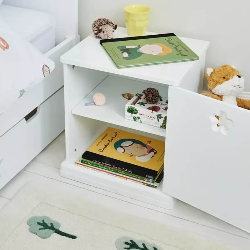 White-painted bedside table with cupboard space and star cut-out detail