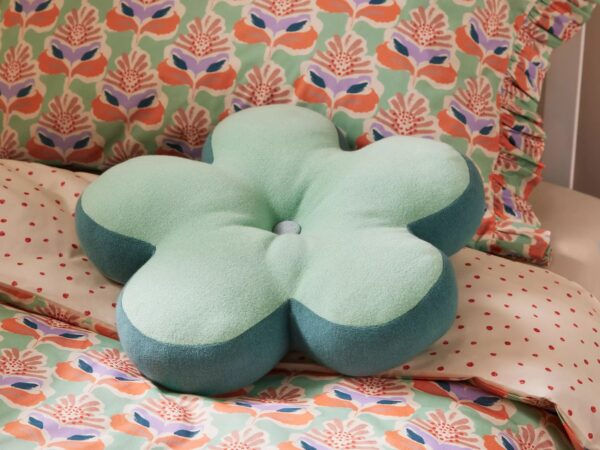 Floral bedding with a flower shaped cushion